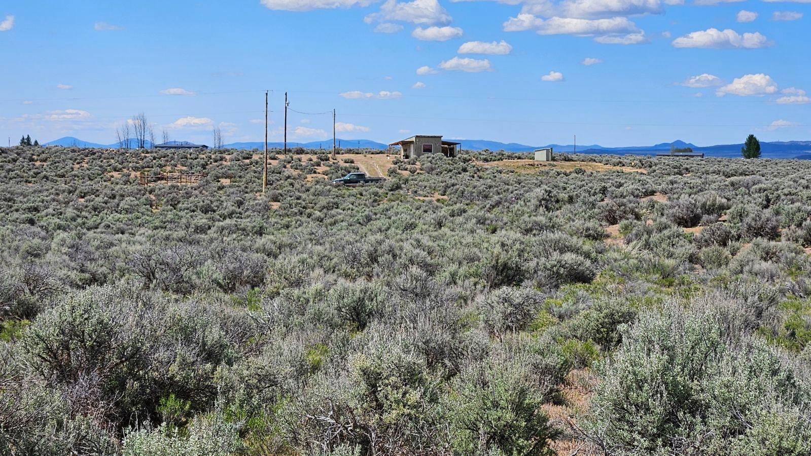 A great place to call home. This Residential zoned lot offers you privacy and views. The adjoining lot is also for sale so you would have the option of owning 2+  acres or you could build a home o each lot. Bring your ideas and don't miss out on this great opportunity. Come to this great community that has so much to offer. Enjoy a day on the sand dunes with your ATV. Go visit the many geographic sites, go play a round of golf or have a great meal at one of the local restaurants. Get away from the hustle of the city and enjoy kicking back in this small community.