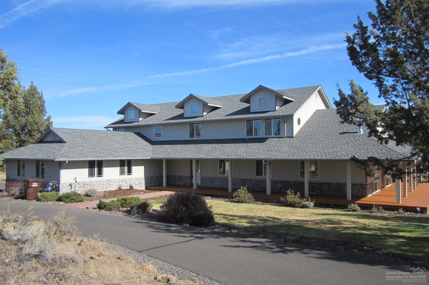 Don't miss this one! Rare West Powell Butte Estates home with 20 acres, gated community with private location, and Smith Rock views. The home features an inviting open floorplan with covered wraparound porch, water feature, paved driveway, 4 car garage, hardwood flooring, fireplace and more. The oversized 54x60 shop with 4 8' overhead doors, 12x12 tack room, 12x60 hay storage will hold all of your toys and animals. Property is fenced for horses with easy BLM access. Too many features to list!