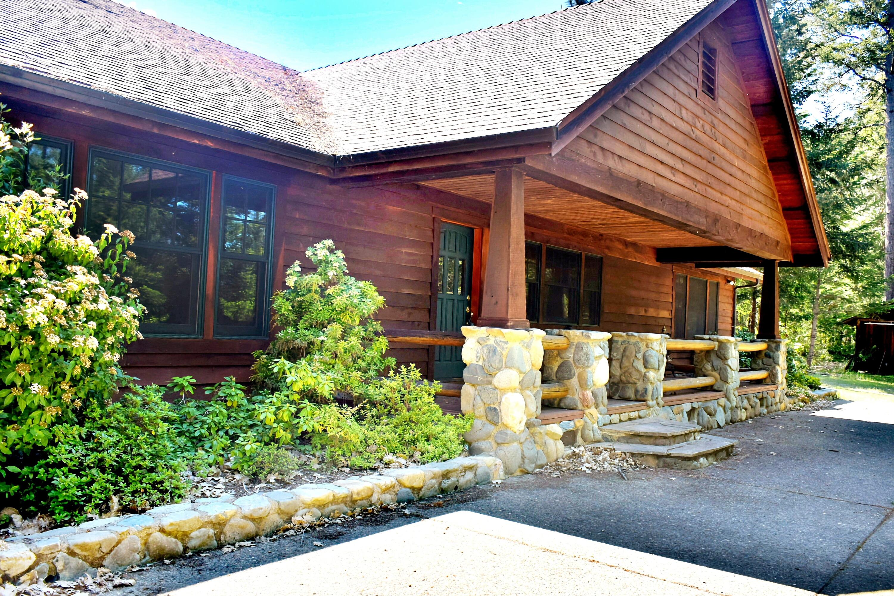 back on by no fault of prop. Capture  escape with this incredible 3 BD 2.5 Bath knoll set home featuring an amazing view of the valley. Custom river rock pillared covered deck welcomes you to the lodge style entry.  2300 sq.ft with a formal dining room and spacious dining room for entertaining. A wood stove provides excellent warmth but is in addition to the heat pump.  Abundant well placed closet space and custom cupboards line the house. The kitchen has tile counter tops and an Island. The open floor plan throughout is set with hardwood floors and carpet within the living room and bedrooms. There is a  heated shop for tinkering, with storage and a nice workbench, even wired 220! The attached house garage provides parking. Outside the local milled redwood sided house, you'll even find space for a garden, gentle sloping land adorned with a rock path, a woodshed and a chicken coop. The east facing porch is perfect for summer tea in the shade. So many details  you'll notice when you vis
