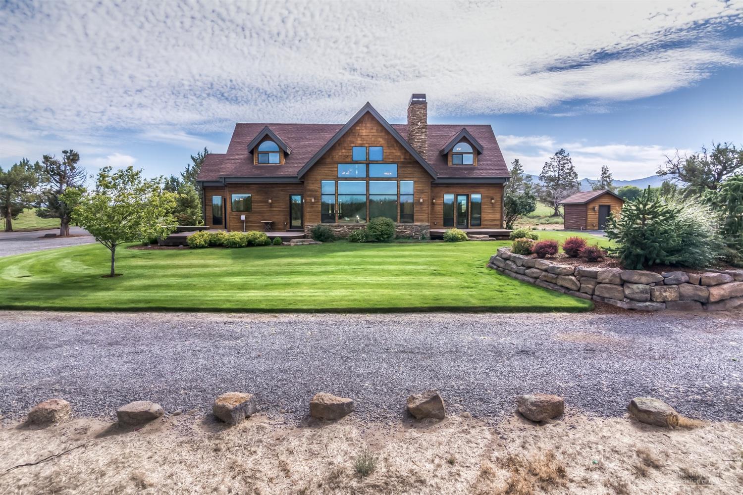 Welcome to this single owner custom home on 4.43 acres nestled nicely between large parcel ranches. Privacy abounds at the end of a no outlet street. Plenty of room for a shop or barn. Come experience this one of a kind home that boasts cathedral ceilings, exposed beams and stunning natural light. Little expense was spared in constructing this home including clear cedar siding, sip roof panels to accommodate open beam high ceilings, wood wrapped windows, solid wood doors, and wood trim finishes throughout. Open & inviting floor-plan includes a main level master bedroom with access to exterior deck & breathtaking views. Two additional bedrooms upstairs contain expansive closet & storage space. Also upstairs a full bath & loft area. Don't miss the bonus room above the garage, a great place for gathering! Home was built w/ intention & integrity & has continued to be lovingly cared for & maintained. Property is fenced, includes a pond & recorded access to BLM via foot or horseback.