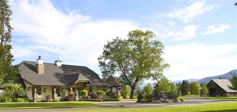 Applegate Valley Estate in the heart of our Wine Country! The custom home, guest cottage, 2000 s/f patio with outdoor kitchen, and covered decks rest amongst exquisitely landscaped grounds with 3 acre bass stocked lake, barn, orchard, and 6+/- acre producing vineyard. This incredible estate offers the ultimate wine country lifestyle with ideal location, setting & infrastructure for winery & tasting room. Current plantings are sufficient to produce approximately 1200 cases of wine. Additional vineyards can be planted to total from 10-15 acres. A Grower sales privilege license can be obtained allowing the grower to sell wines retail, wholesale, & export''. Wines can be made by one of the local wineries if desired. The Lake & lakeside park with tree lined walkway & maze is designed (including water & power) for a lakeside gazebo, glass house or a tasting room tucked back among the large oak trees. Sale subject to completion of lot line adjustment to incl aprox 24 ac.