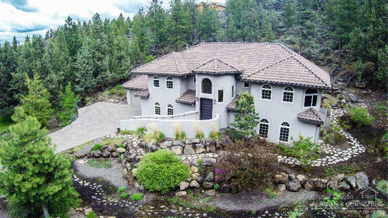 Contemporary Spanish style home nestled into the hillside overlooking Awbrey Glen's 12th Fairway. Builder's custom home, ICF construction, extensive cabinetry & woodwork, Great Room style living. Chef's kitchen w/NEW expansive granite counters & bar looks out to living area & floor to ceiling gas fp. Main level executive office w/fp & western views. New tiled Master Bath, garden tub in 2nd Master. Built-ins in each room for easy organization. 1300+sf garage, family room & wine grotto. Too much to list!