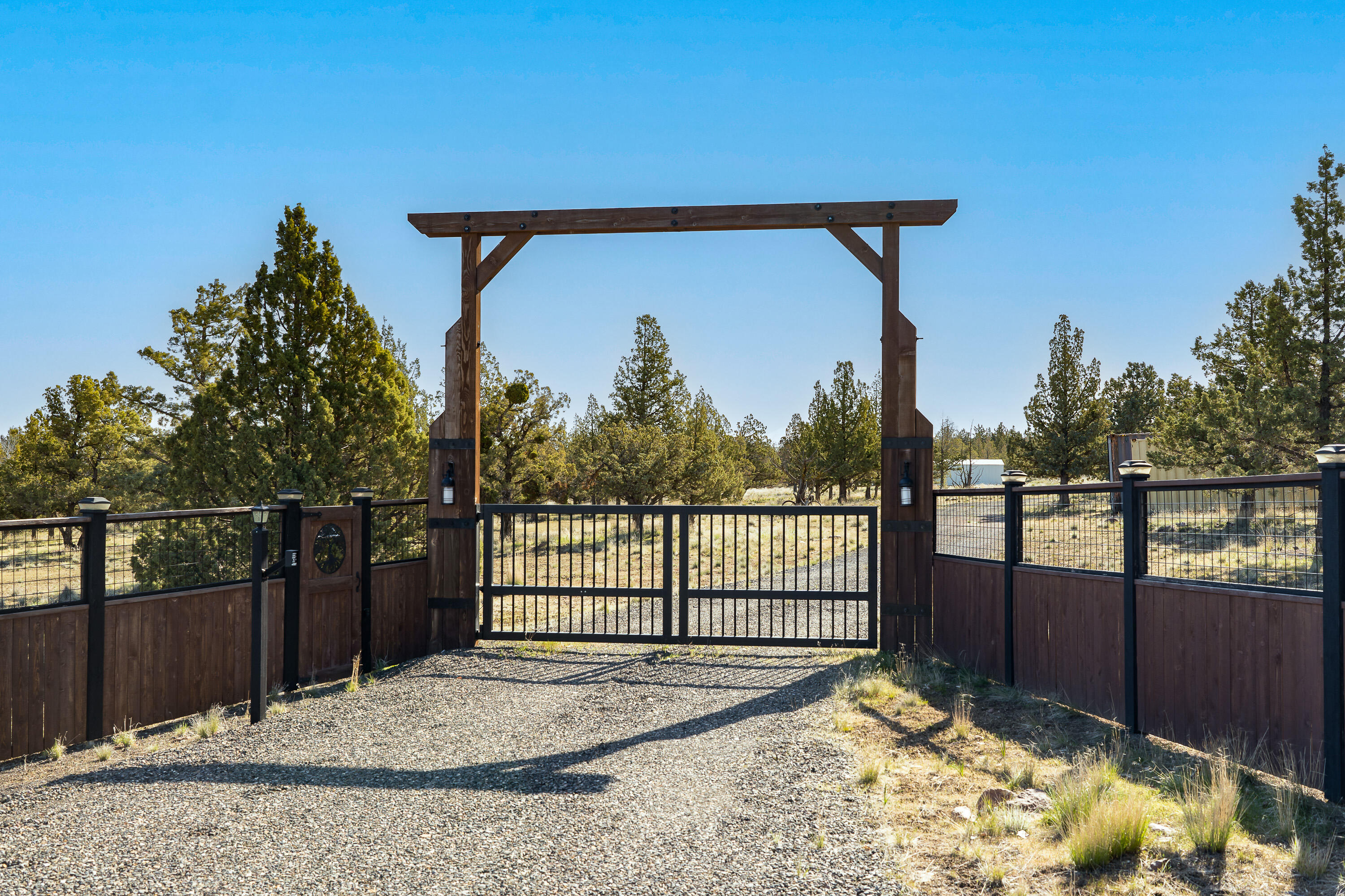 Discover the ideal homesite with Cascade Mountain and Smith Rock views! This 5-acre parcel in Mountain View Estates offers a flat, rectangular plot amidst upscale homes, paved streets, and buried utilities—no HOA fees. Installed Avion water with frost free spigot, CEC electric (400-amp service), and approved capping fill septic system make it ready for your custom build. Enjoy the hand crafted entrance gate, solar-powered with keyless pad. 6-foot deer fencing enclosing the entire perimeter for added privacy and security.  A 10x25 metal shed with concrete foundation is on-site. Located on a quiet cul-de-sac, Joshua Court ensures tranquility. Bring your Builder and explore this spectacular property to capture the views.