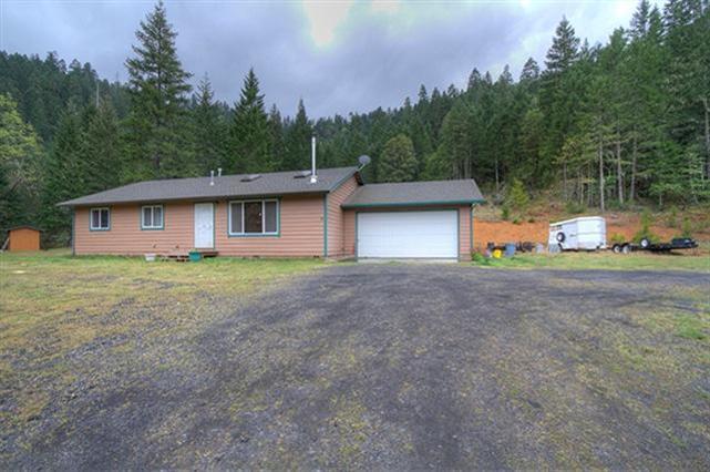 Well-Kept Single-Level 3 Bed, 2 Bath 1334 Sq Ft Frame-Built Home in Selma on 40.78 Acres! Offering a Simple and Attractive Floor Plan, this Home is perfectly matched for the setting, offering an Open and Spacious Living, Dining, and Kitchen Area with Vaulted Ceilings, Woodstove, and Skylights. Large Master Bedroom. Attached Two Car Garage, plus room to park RV's, Boats, Trailers, and more. Beautiful Property offers a Nice Variety of Terrains including Open Pasture and Woods. Plenty of Level Land for Horses and other Animals. Seasonal Creek and Year Round Pond. Backs BLM for easy Hiking and Exploring right from your own property. Pretty Mountain Views. Set-up with self-sufficiency in mind, including Gravity-Flow Water to the House, and some Propane- Driven Appliances. Fenced and Gated Entry. Located a short 5 minute drive from Lake Selma for further fishing and recreation possibilities. Overall a very pretty and secluded setting. A Lovely Home and Property!