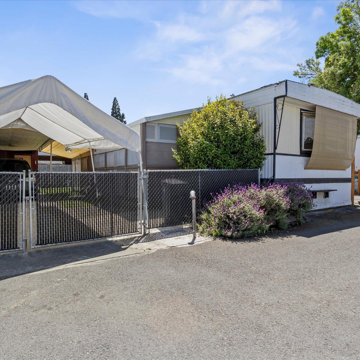 Becoming a homeowner has never come at a better deal than this 784 SF Bonnaville Manufactured Home. 2 bedrooms, 1 bathroom, and a generously sized living area make for bright and open spaces throughout the home! Outside you'll find covered parking, a covered breezeway/sunroom and an additional shed for storage and parking. Come check this place out and see how easy it is to make your home-owning dreams come true.