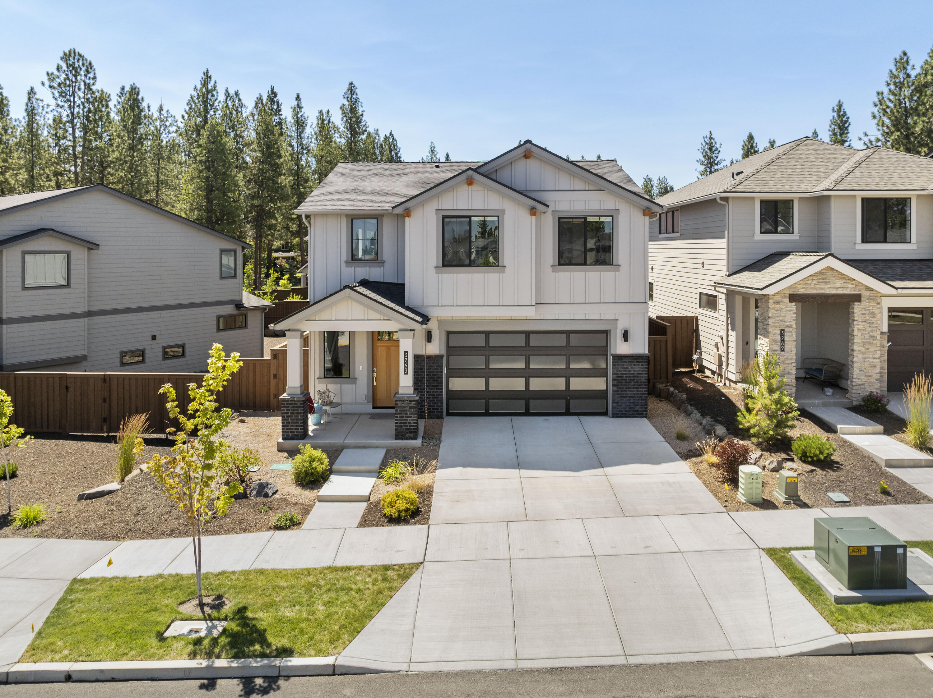 Built in 2023, this NW Bend home offers the perfect blend of modern efficiency and an unbeatable location. Featuring 3 bedrooms plus a versatile loft, this home is just one block from the Discovery Trail & three blocks from Shevlin Park, placing outdoor adventure right at your doorstep. Enjoy an open and bright floor plan with beautiful hardwood floors, fresh colorful interior paint, a large quartz island, an induction cooktop, and a tankless hot water heater for endless efficiency. Upstairs windows feature solar film for added comfort, and the Home Energy Score of 10—thanks to the owned solar panels—keeps your electric bills remarkably low. Relax on the covered Trex back deck overlooking the fire-hardened, low-maintenance landscaping. The two-car garage includes overhead racking for additional storage. HOA covers front yard landscaping and the neighborhood park. Wired for a hot tub. Don't miss this energy-efficient, move-in ready home in one of Bend's newer neighborhoods.