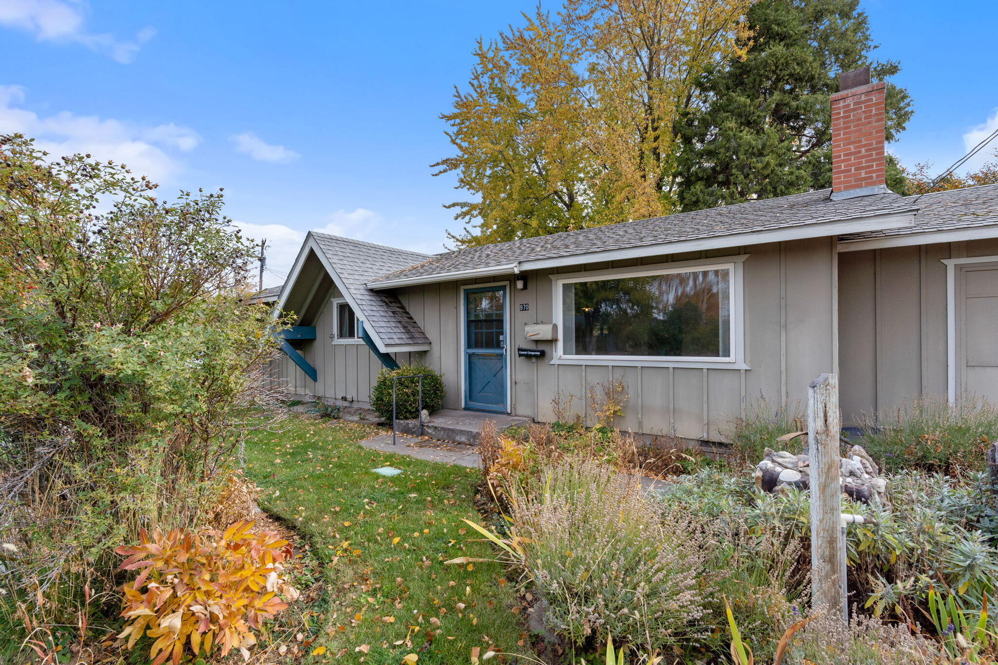 This charming 1963 cottage on a .15 acre corner lot is a must-see! With 3 bedrooms & 1 bath, it offers 1,196 sqft of cozy living space, featuring original hardwood floors & gas fireplace. The beautifully landscaped front yard is filled with vibrant perennials, while the private backyard boasts a covered patio, two storage sheds, RV parking, & a workshop in the garage. Don't miss out—call your real estate agent today! Sold as is!