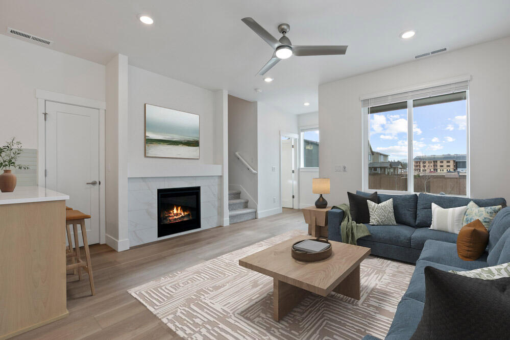 Easton homesite #118 - MOVE IN READY - introducing the new 1,450 sq ft Parkside floor plan on Lot 118, recently completed. This well designed townhome is rafted for modern, easy living. Features include quartz countertops, luxury vinyl plank flooring, a gas fireplace, tile backsplash in the kitchen and baths, tankless water heater, air conditioning, fenced side yard, and side patio. Enjoy effortless upkeep with HOA-maintained front yard. All appliances are included — stainless steel range, dishwasher and microwave PLUS refrigerator, washer, dryer, and window coverings. Located in Easton, a thoughtfully designed SE Bend community offering green spaces, swimming pools, a gym, and more. Live where convenience meets comfort in one of Bend's most exciting new neighborhoods. Photos of actual home virtually staged.   Buyer bonus available when using builder's preferred Lender.  See site agent for details.