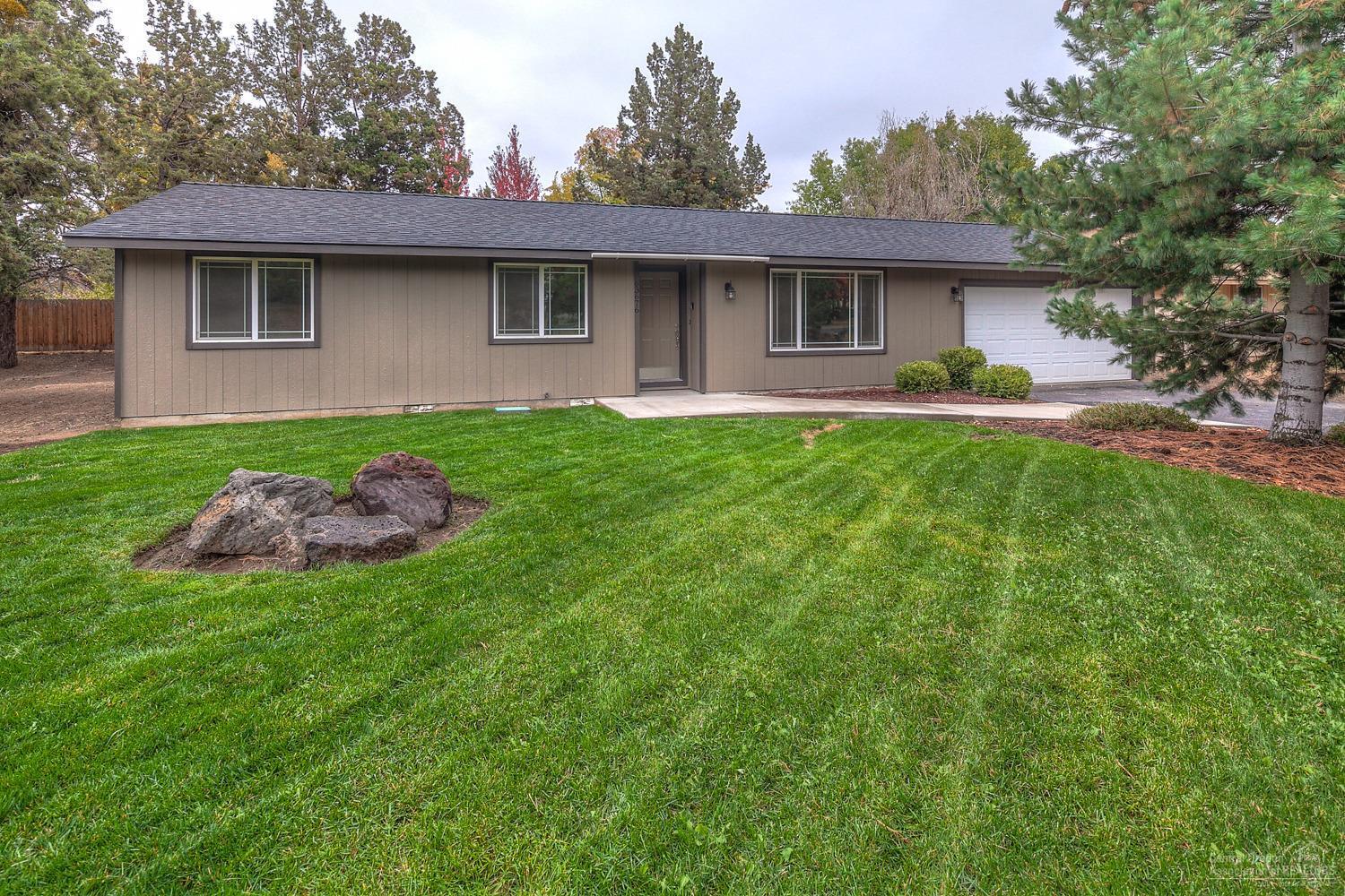 NE Bend home on .34 acres, completely re-finished including roof,paint, grg door, flooring & more! Hickory & Maple cabinets. New appliances & fixtures throughout. Extra large bar area w/tons of storage & ctr space. New hardwood, custom tile, premium carpets. Beautiful granite counter tops in the kitchen & Master bath. Tiled floors & tub surround in guest bath. Tons of space for shop, toys, rv's or home addition. Property backs to the canal greenbelt that runs for miles.