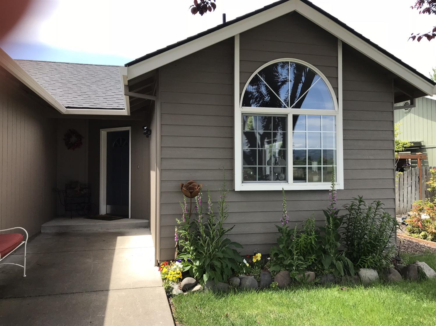 Well maintained 3 BD / 2 BA, light and bright interior with a lot of windows, and sky lights. Walking distance to Stewart Meadows Golf Course, new Providence Urgent Care Center and extensive park grounds. Mountain View's of the Cascade Mountain Range out the front windows, and private back yard with patio and beautiful landscaping including an automatic sprinkler system. Enough RV parking on side for additional RV, Boat, or trailer. Enjoy walking, biking, and close proximity to south end shopping.