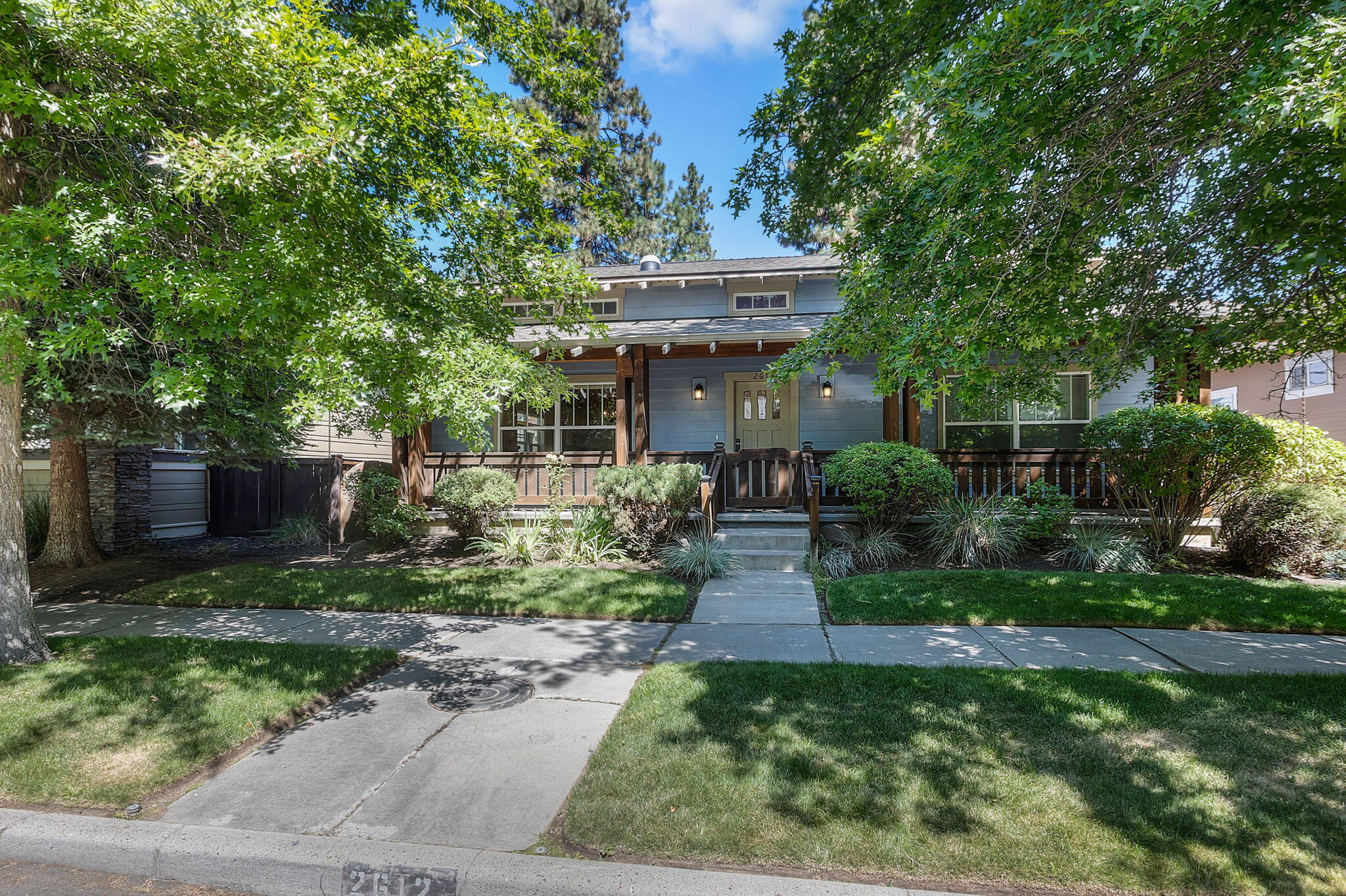 Welcome to this charming single-level craftsman in highly sought-after Northwest Crossing! From the inviting front porch to the open-concept layout, this home is designed for comfort and entertaining. Enjoy soaring ceilings, hardwood floors, exposed beams, and a cozy gas fireplace. The kitchen boasts Silestone counters, alder cabinetry, and a walk-in pantry, with a dining area perfect for gatherings. The private primary suite with backyard access features a walk-in shower, dual sinks, radiant-floor heating, and Silestone counters, while two additional bedrooms (all with brand-new carpet and pad) offer flexibility for family, guests, or a home office. Outside, a spacious deck and low-maintenance yard create the perfect setting for outdoor living. Nestled in one of Bend's most desirable neighborhoods w/ parks, trails, shops, and dining nearby, this home is priced to sell quickly. Now the primary, hall bath and living room feature new neutral paint (not pictured)! Welcome home to NWX!