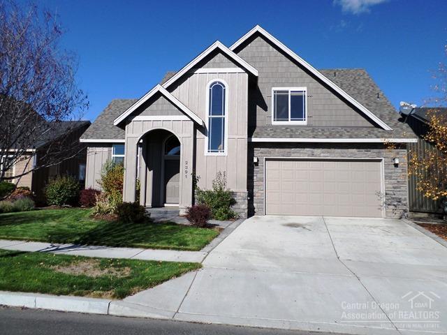 Quality craftsmanship in beautiful Megan Park Subdivision! This 4bed, 3bath home offers slate entry, extended rock faade, granite tile counter tops in kitchen, wood wrapped windows, vaulted ceilings, gas fireplace w/custom mantel & slate surround and convenient upstairs laundry. Freshly cleaned carpets & refinished hardwood floors! Large fenced & landscaped backyard with sprinkler system & nice size back patio. Insulated & finished 3 car tandem garage. Come see today, wont' last!