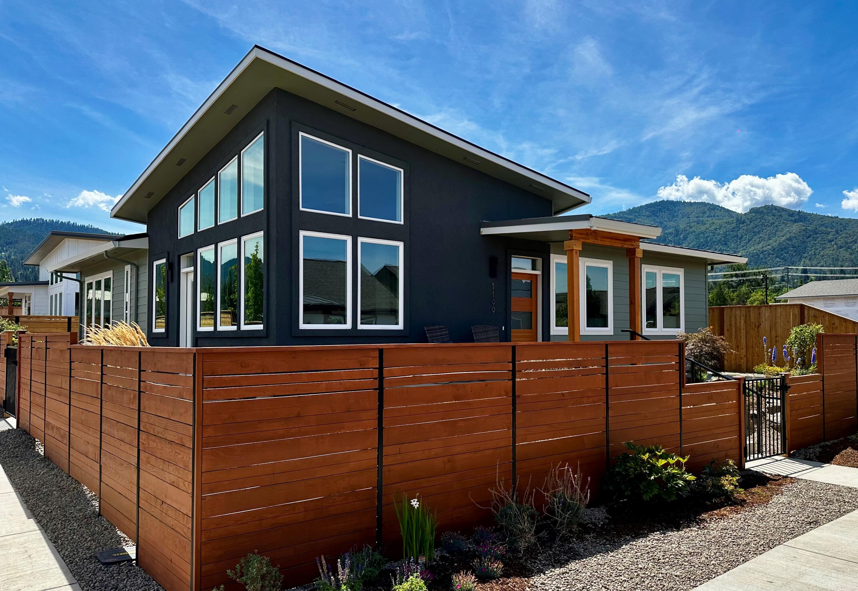 Welcome to Lot 30 in the Beach Creek Subdivision - a beautifully designed 2-bedroom, 2 bathroom home offering 1,275 square feet of modern living space. Thoughtfully built by DKA Homes, this residence is part of Ashland's net-zero Solar community and is ideally located for easy access to all that this charming town has to offer. With a sleek, contemporary design and large windows that capture stunning views of the surrounding mountains, the home is filled with natural light throughout. It's certified Earth Advantage Platinum for sustainability and features net-zero solar capabilities along with fire-wise construction--providing both environmental efficiency and peach of mind. In addition to the home's many features, residents enjoy access to a community garden, three nearby parks, and a private park managed by Beach Creek, making this an exceptional place to live, relax and thrive.