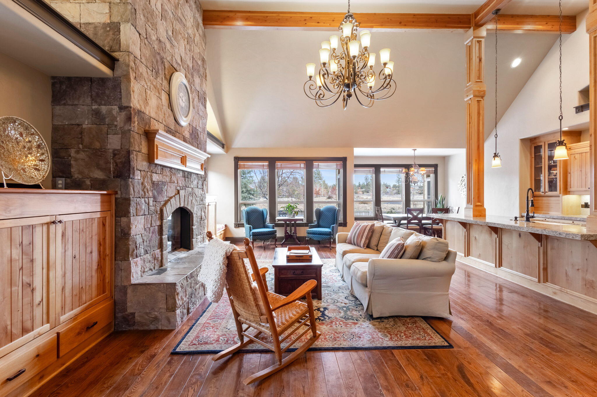 Unobstructed meadow views, large lot, four bedrooms plus office, and 3-car garage in SW Bend's beautiful River Rim neighborhood! This beautifully constructed home has vaulted ceilings in the entryway and great room, which has a beamed ceiling and an impressive floor-to-ceiling fireplace. The primary suite is on the main level with two large walk-in closets! The second bedroom on the main level also has an en-suite bathroom. Upstairs, the third bedroom and extremely large fourth bedroom have a Jack-and-Jill bathroom. Storage shed blends in with home style and colors. Enjoy the expansive views of the 5+ acre meadow from the comfort of your own home and deck, or take the trails from your front door to Wild Flower Park, River Rim Park (on the Deschutes River), Sunset Hill for a great 360-degree view of Central Oregon, Brookswood Plaza, and the Deschutes River Trail.