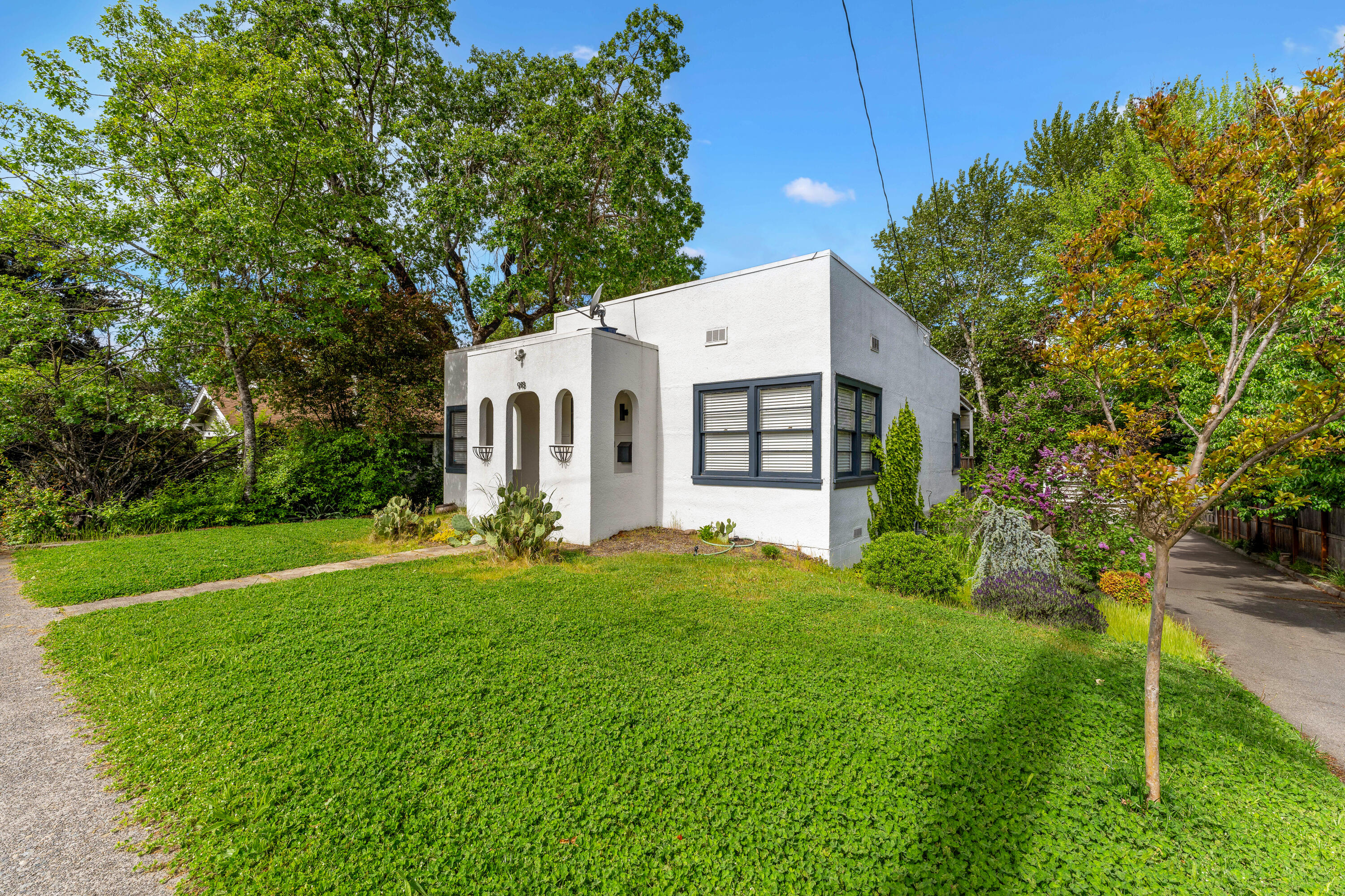 *FHA assumable loan 2.5% interest rate.seller willing to discuss the assumable option*

 Welcome to 918 NE 8th St. This home sweet home is set on a LARGE lot and conveniently located in the middle of town.You can enjoy all that Grants Pass has to offer with just a quick walk, bike or drive.A perfect location and house for an Airbnb! 
Upstairs features 2 bedrooms and 1 full bath, a spacious kitchen with an island set for 2-3 barstools, a built in breakfast nook, and a built in coffee bar. 
Downstairs the converted basement has been turned into a primary bedroom with a full attached bath and laundry.New AC and furnace installed within the last year and a half!Outside features a large backyard and deck perfect for hosting your friends & family this summer, with space for RV parking. Maybe turn the detached garage into an ADU??Whether you envision this home as your primary residence, a rental property (such as it is now), or an Airbnb, the possibilities are endless and are sure to tur