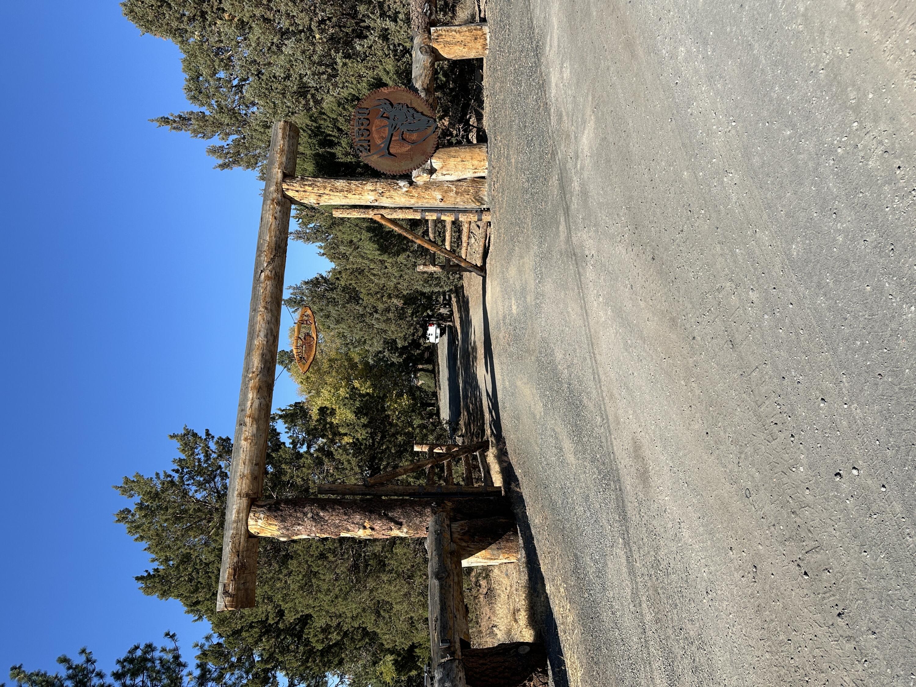 Beautiful full Mountain views from 4 bedroom, 3 bath home & property. Fenced and gated, Huge Logs. Hot tub deck, built in horse shoe pit & volleyball court in yard. Big rubber lined pond with 2 islands & a bridge with picnic area, sand beach & cabana at swimming area. Lots of grass with water feature. 3600 SQFT shop with 14 Ft doors. Avion &
well water