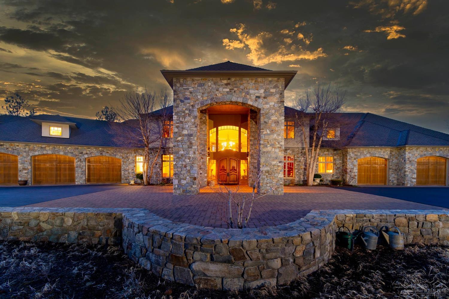 Epic French Country super custom estate situated on 2.8 acres (2 lots) with a breathtaking vantage point of Lost Tracks 10th fairway, nestled among ponderosa pines and inspiring Cascade mtn. views. This entertainer's dream has something for everyone: romantic double grand staircase, a chef's kitchen w/ high end appliances, main level deluxe master suite, executive den, 2 dual room guest suites, billiard room with bar & arcade, library, kid's castle room, art/pottery studio. Not to over look the 2 - triple car garages w/ project bay & lift encompassing 3500+ sf alone w/ personal gym - for the moto-project person. This home was hand-crafted for hospitality with extensive main-level dining/sitting rooms along with extensive rear patio entertaining w/ professional landscaping (built-in BBQ, potting room & water features) that melt right into the gorgeous golf course. Have everything & be close to everything - book a showing today!<br>