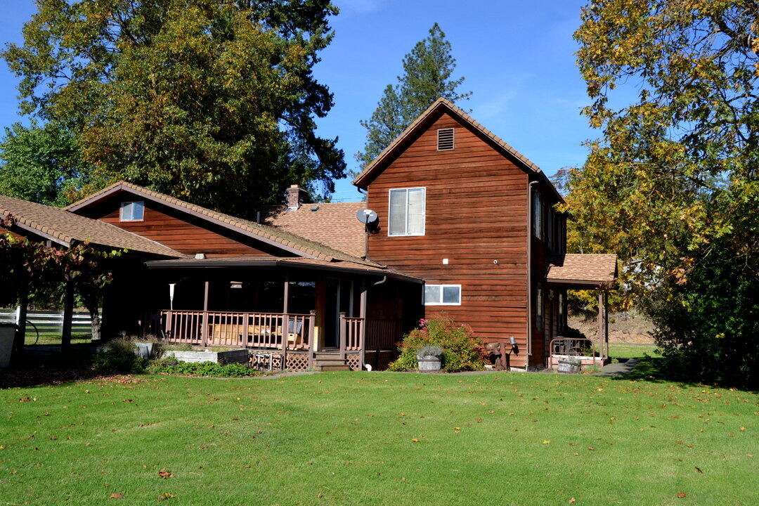Amazing Rogue River working ranch and former dairy with all the outbuildings and equipment to keep it operating—or transform it into a premier horse ranch or hay farm. The soils are among the best in the region, proven by its rich history of producing hay and corn. The property includes multiple quality outbuildings, a charming and well-maintained historic farmhouse, and irrigation equipment drawing directly from the Rogue River, with ample river frontage. With over 65 acres of water rights and the renowned Rogue Creamery next door, this property offers endless potential for income, agriculture, or simply an exceptional rural lifestyle along one of Oregon's most scenic rivers.