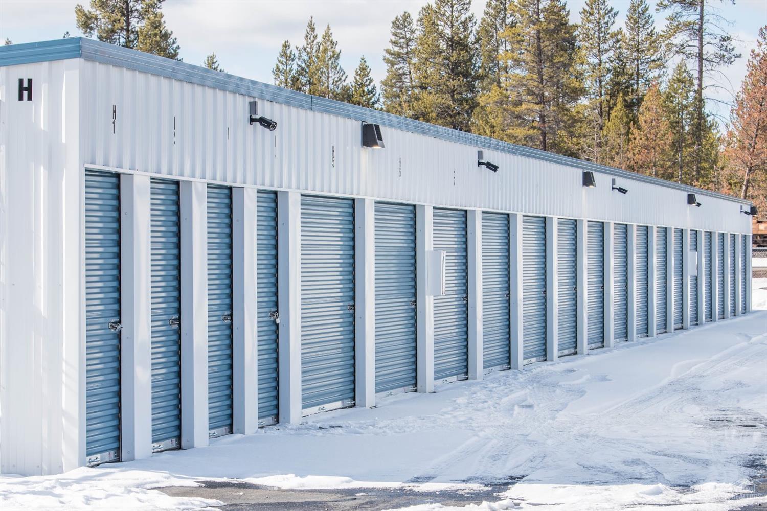 233 unit self storage facility on Highway 97, includes a recent expansion and paving of the entire facility. The facility is fenced, has a security gate and cameras for 24/7 monitoring. All metal construction surrounded by asphalt for clean and easy access. There is a manager's apartment with an attached office for the manager, and a kiosk where customers can have 24 hour access to rent a unit on site. The expansion is now fully operational.