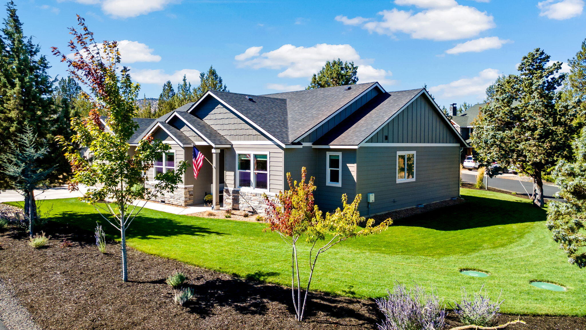 Experience Central Oregon living at it's finest in this newly built 2023 craftsman style single level home in the desirable Ridge at Eagle Crest golf community. Step inside to vaulted ceilings and an open floor plan perfect for entertaining. This home features upgraded California Closets, a beautifully designed kitchen, stainless appliances, custom window treatments and has a large custom water feature! The primary suite is very spacious and has a large walk-in closet, a walk-in shower and double sink vanity with soaking tub. The attached two car garage includes epoxy floors for a clean polished look. This home boasts a large corner lot with a sprinkler system and beautiful landscaping.