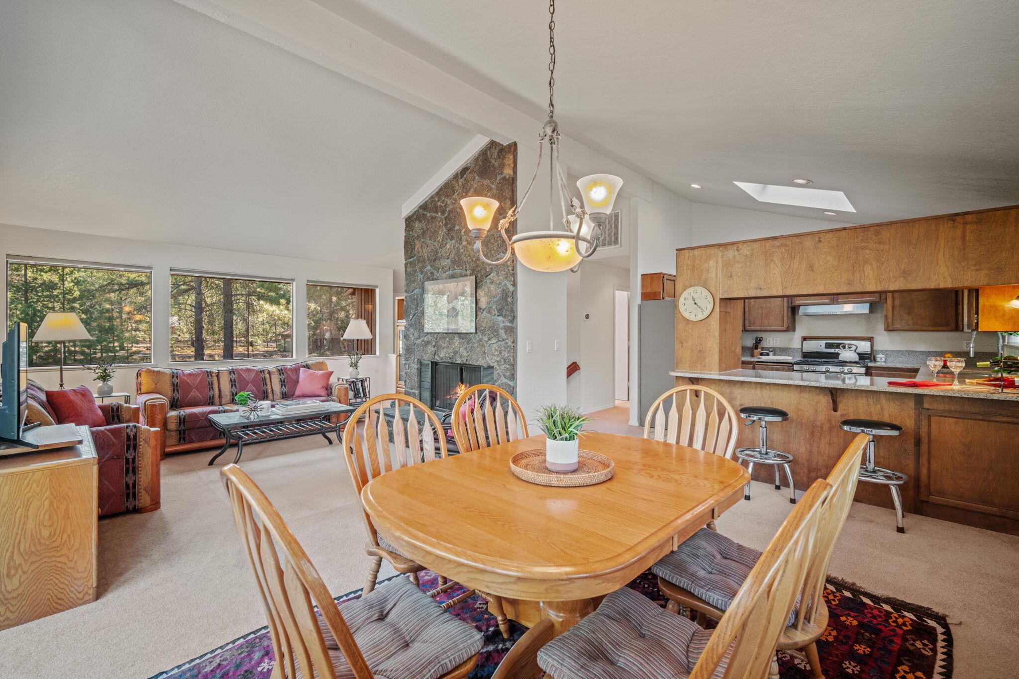 Welcome to your very own cabin in Sunriver, Oregon! This 1,879 square-foot, 3-bedroom, 2-bath home blends rustic charm and comfort, perfectly positioned near Fort Rock park, SHARC, the Village and miles of bike paths. It's the ideal launchpad for year-round outdoor adventures or a secluded, restorative getaway. Three decks extend the living spaces outdoors, for morning coffee and evenings under wide-open skies. The daylight-filled downstairs family room centers around a wood-burning stove, with two comfortable bedrooms, a full bath and laundry room. Great for guests or family to unwind. Upstairs, windows invite in natural light & treetop views to a vaulted great room anchored around dining area, granite countertop in the kitchen with a breakfast bar, lava rock hearth and fireplace. Primary suite has private deck, large bath & walk-in closet. This Sunriver gem promises relaxation and adventure in equal measure. Large lot, new furnace, metal roof, asphalt driveway and attached garage