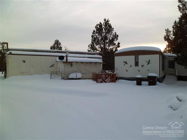 Value is in the land and shop! Large, fenced, level and nicely treed parcel. Existing manufactured home needs the help of a handyman or build your dream home on this property. Priced to sell!