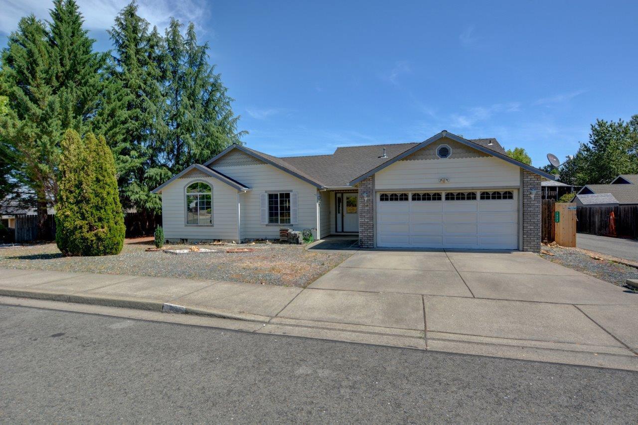 When we say 'It's a great neighborhood!', it's true. Close to Shopping, Dining and the Rogue River. Attractive Ranch style home built in 2000 has recently been upgraded. Living Room has Open Floor Plan with Vaulted Ceilings and special cut outs for decorator pieces or collections. Walls of wndows look out into the Backyard. Open Kitchen with upgrades open to Dining Room with Slider to Backyard. The Suite has it's own Full Bath and Slider to Backyard. Two other Bedrooms have Large Windows and are good size. Two Car Garage with Laundry area. Don't miss out on this special place!