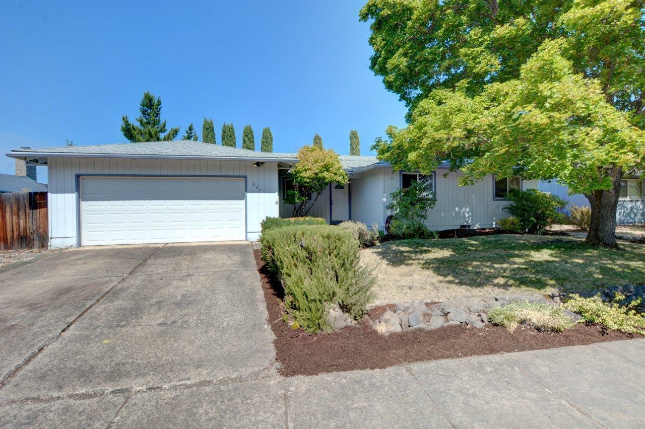 Welcome to this lovely 3 bedroom, 2 bath home, offering 1,602 square feet of comfortable living space on a spacious .23-acre lot. Brand new roof with 50 year transferrable warranty! The updated kitchen has tile floors with the look of wood and rough-edged, decorative stained concrete countertops. The kitchen opens into the drop-down living room through a standing bar. There is a separate family room with a cozy fireplace and a slider to the backyard that provides flexible space. Enjoy the large backyard that is fully fenced, with an expansive partially covered deck, and a gazebo, wired for a hot tub. The finished, insulated 2-car garage with wall A/C is perfect for a workshop, hobby room, or parking. Located near Twin Creeks, restaurants, shops, parks, medical, and pickleball courts. 1 year First American Home Warranty with HVAC coverage. included!  Schedule a tour today!
