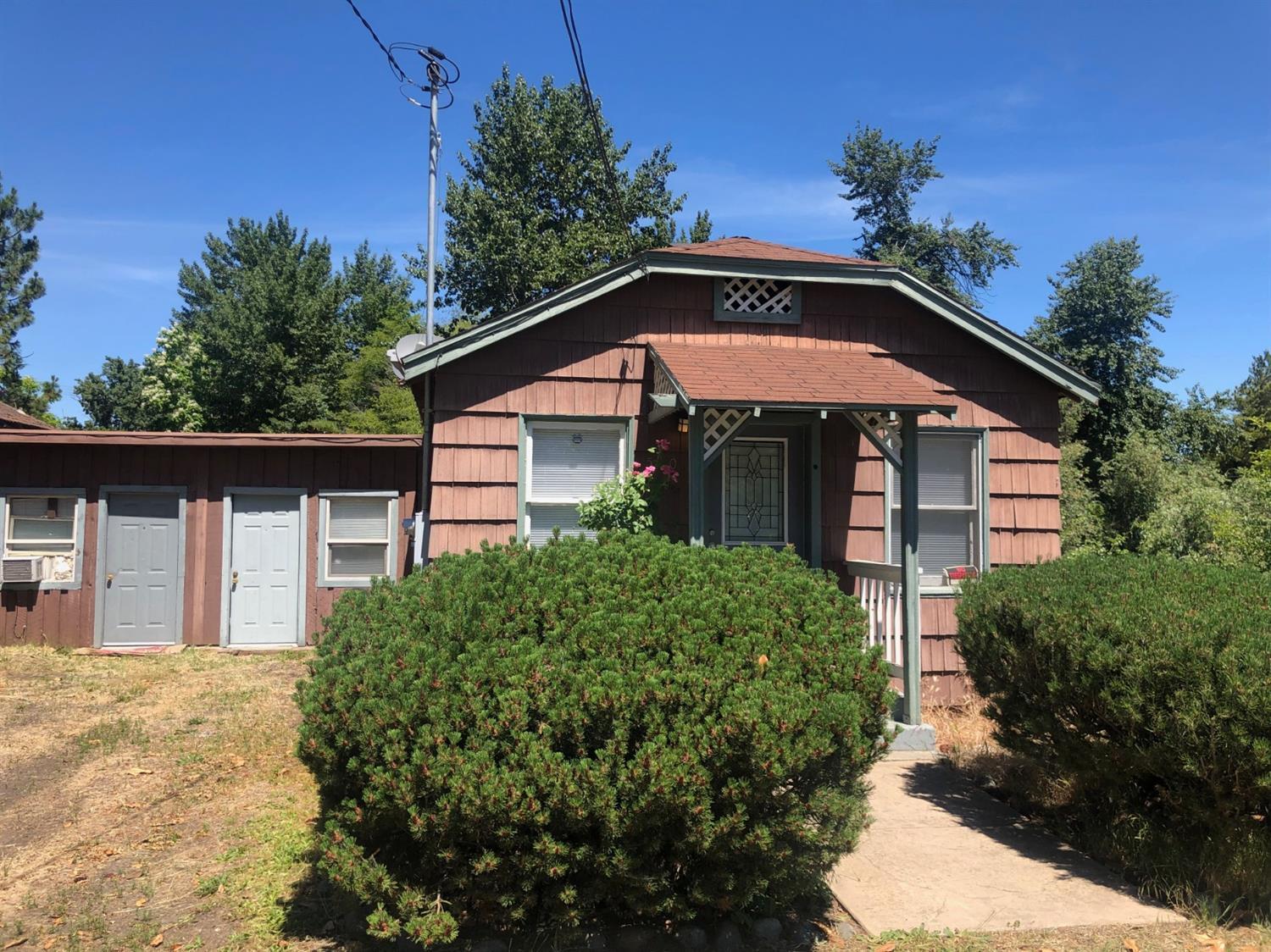 Located next to bear creek, you will feel secluded although you are just a minutes from downtown and RCC! Come tour today! Additional unpermitted unit on back of home is approx 300 sqft. Come and tour! Live in the back and rent the front?