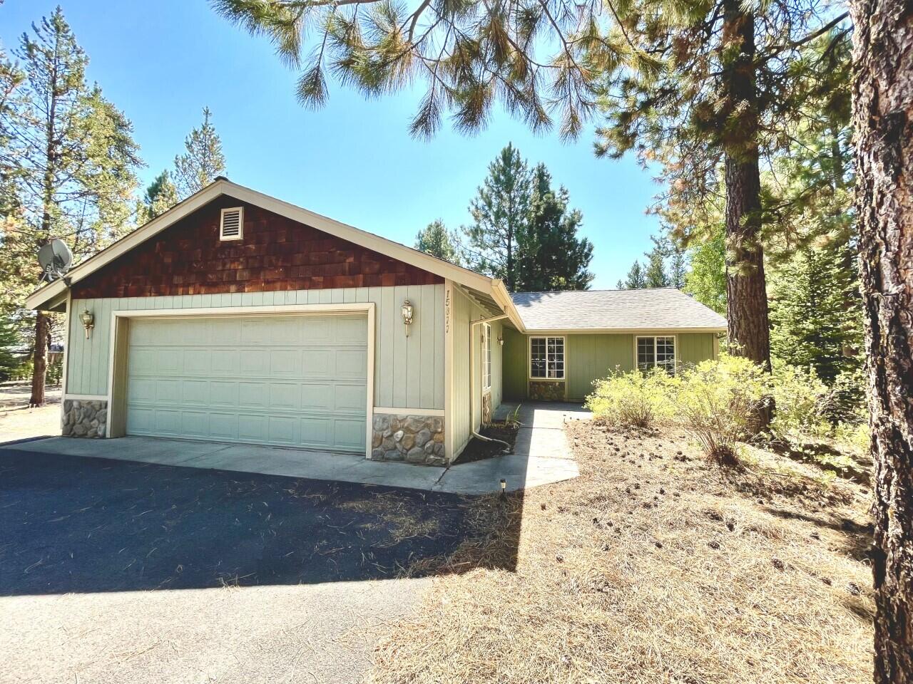 Single level Craftsman Home on an acre with circular paved driveway, fenced with double gates off a paved road. 36X30 Stick Built heated shop has plenty of room to store all your toys. If you love to garden you will enjoy this automated greenhouse! Large back deck wired for surround sound. Attached double car garage, family room with french doors to the back yard, open living room with pellet stove surrounded with river rock, wood floors in the living area and new roof in 2020.