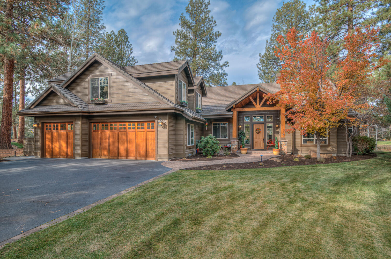 This fabulous home on Green Lakes Loop in Broken Top features a split plan with multiple upgrades and unique features and a view out to the 16th green and 17th tee box. Enter in the large vaulted living room with a view of the golf course. The remodeled modern kitchen flows into the dining and tv areas and features a built in refrigerator, freezer and wine/beverage refrigerator with a center island. Main floor living includes 3 bedrooms (the large primary suite with bathroom and WIC, and 2 bedrooms), office, living room, kitchen, dining, tv area, one full bathroom, a half-bath, laundry/pantry room and a 3 car garage with built-ins. Upstairs you'll find a bonus room/guest suite with a remodeled kitchenette and bathroom with it's own eating area. The back patio provides an ideal outdoor entertainment area with a forested feel and water feature. Experience a life of comfort while taking advantage of the exclusive amenities offered by the award-winning Broken Top golf course and community
