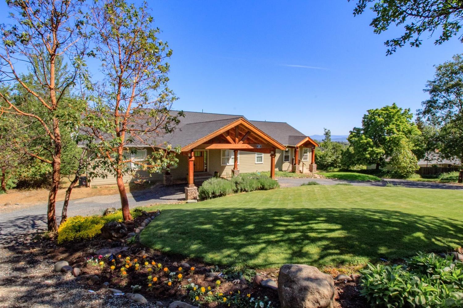 Great Southwest Medford home first time on the market! Built in 2004, this 4 bedroom, 3 bath home on 2.5 irr. acres has 2880 sq. feet all on the main level. Features include an open floor plan with the kitchen in the middle of the home, making it a perfect place to entertain! Beautiful Brazilian cherry floors in the entry, great room and kitchen. Great room features a fireplace and is wired for surround sound. Kitchen offers a huge granite island with gas cook top, double ovens, trash compactor and kick plates. Master bedroom has a large walk in closet, nice views and master bath with soaking tub, separate shower, dual sinks and heated tile floors. Bedroom 2 has a bathroom with shower and heated floors that adjoins it. Other amenities include extra large mud room, central vac, beautiful deck that takes advantage of the views, 2500+ sq. foot basement that can easily be finished for additional living space and a 792 sq. foot 3 car garage! Country feel, yet close to town!
