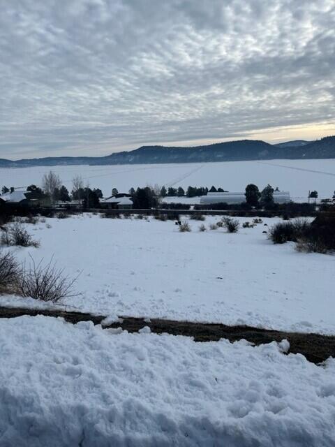 Large home site in West Ridge neighborhood of the Running Y with mountain and sunset views.  It spans from Turnstone to Crossbill with plenty of room for your dream home.