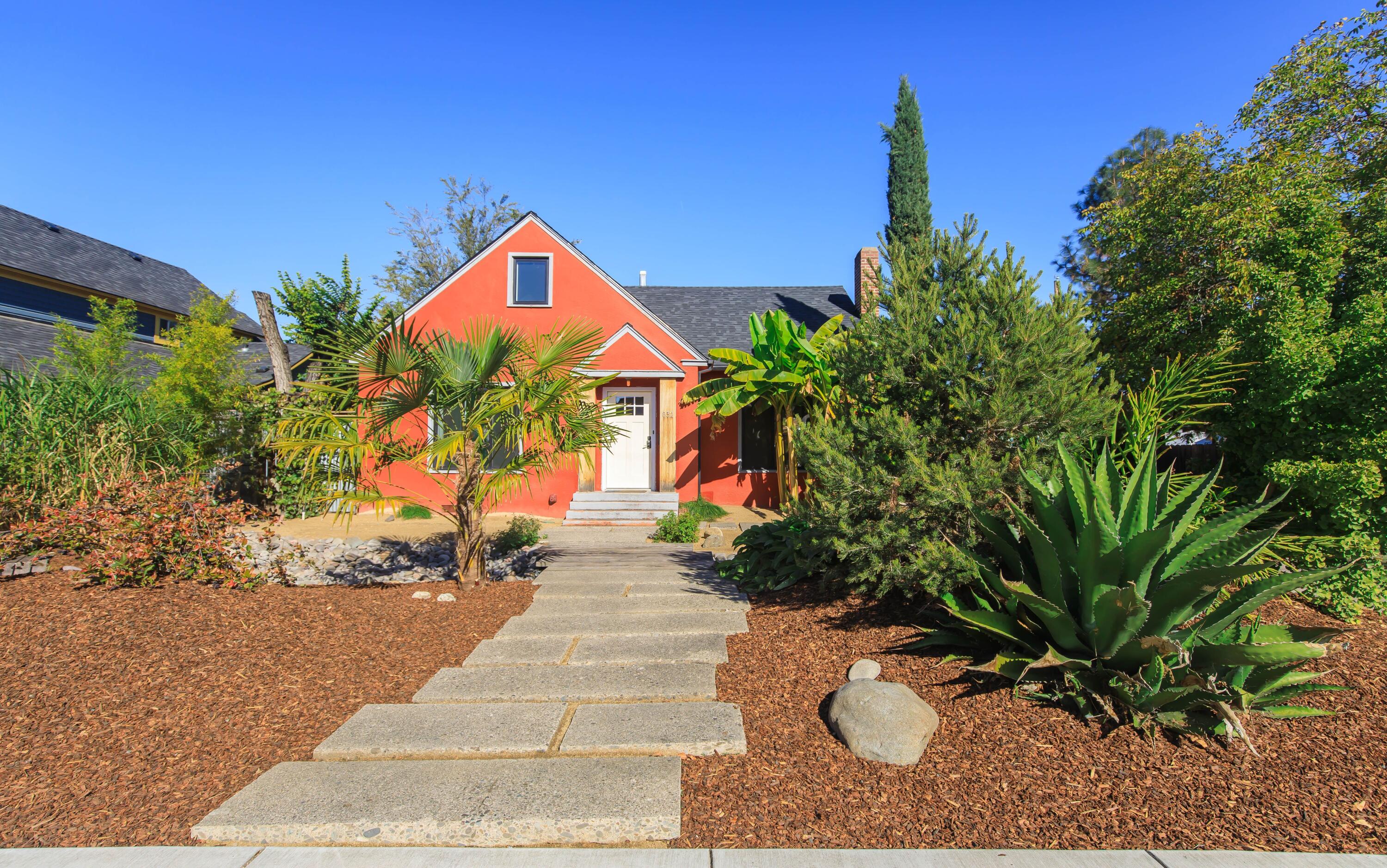 Well cared for home brimming with vintage charm!  There have been many thoughtful updates over the years done with care to not take away from the original character. All living space is conveniently located on the 1188 Sq. ft. main level, featuring original hardwood floors in the living area and bedrooms. The spacious living room includes a cozy wood-burning fireplace, and the adjoining   dining room offers classic built-ins.  The kitchen provides ample cabinet space and  includes stainless appliances.
A convenient  laundry room  provides easy access to the back yard. The  570 sq. ft.  attic has both interior and exterior access, and separate electric and gas meters----currently used for storage but offering many potential uses (buyer to do due diligence).
The yard is nicely fenced and landscaped with a drip system, and the property includes a detached single car garage and has alley access.
