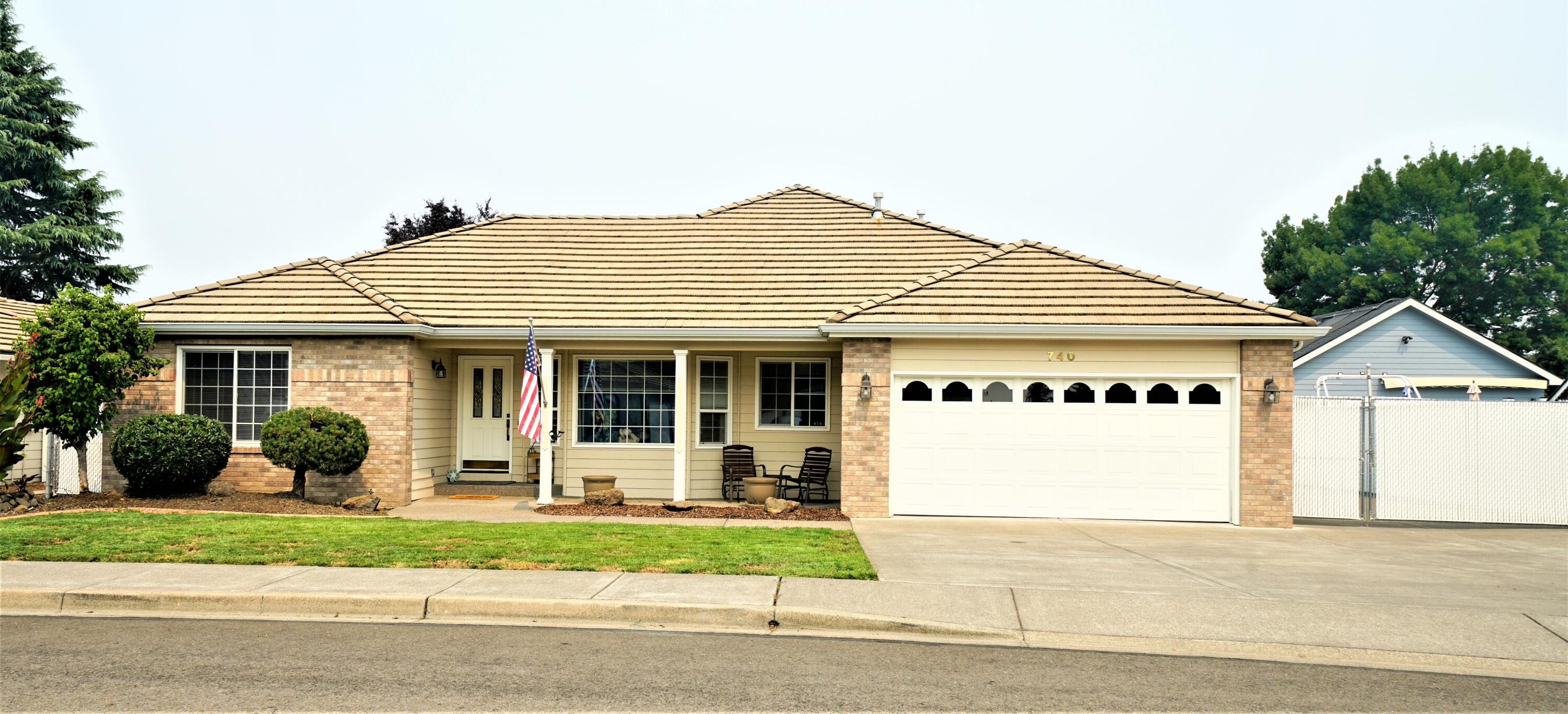 Located in one of Central Point's most desirable neighborhoods, Jackson Creek Estates! This classic community is a tree-lined scene of beautiful homes & well cared for city parks. It is near medical services, the local schools, shopping, & all city services. This lovely home offers quality and comfort throughout. Living, formal dining, & kitchen areas are spacious with ample cabinetry & counter space. Interior is light & bright. Each of the three bedrooms are of nice size, with large closets for storage space. The big mstr. ste. is private, due to the split floorplan and the bath features a jetted tub and a dbl. walk-in shower. The gas fireplace in the living room adds to the cozy ambiance. The living room has easy access to the covered, shaded patio. You'll enjoy the big laundry room, easy care landscape & water feature, detached shop and spacious Gated RV Parking! (65'x 11' & has full hook ups). The finished detached shop is 16'x20', has lights, heat, and could be a studio!