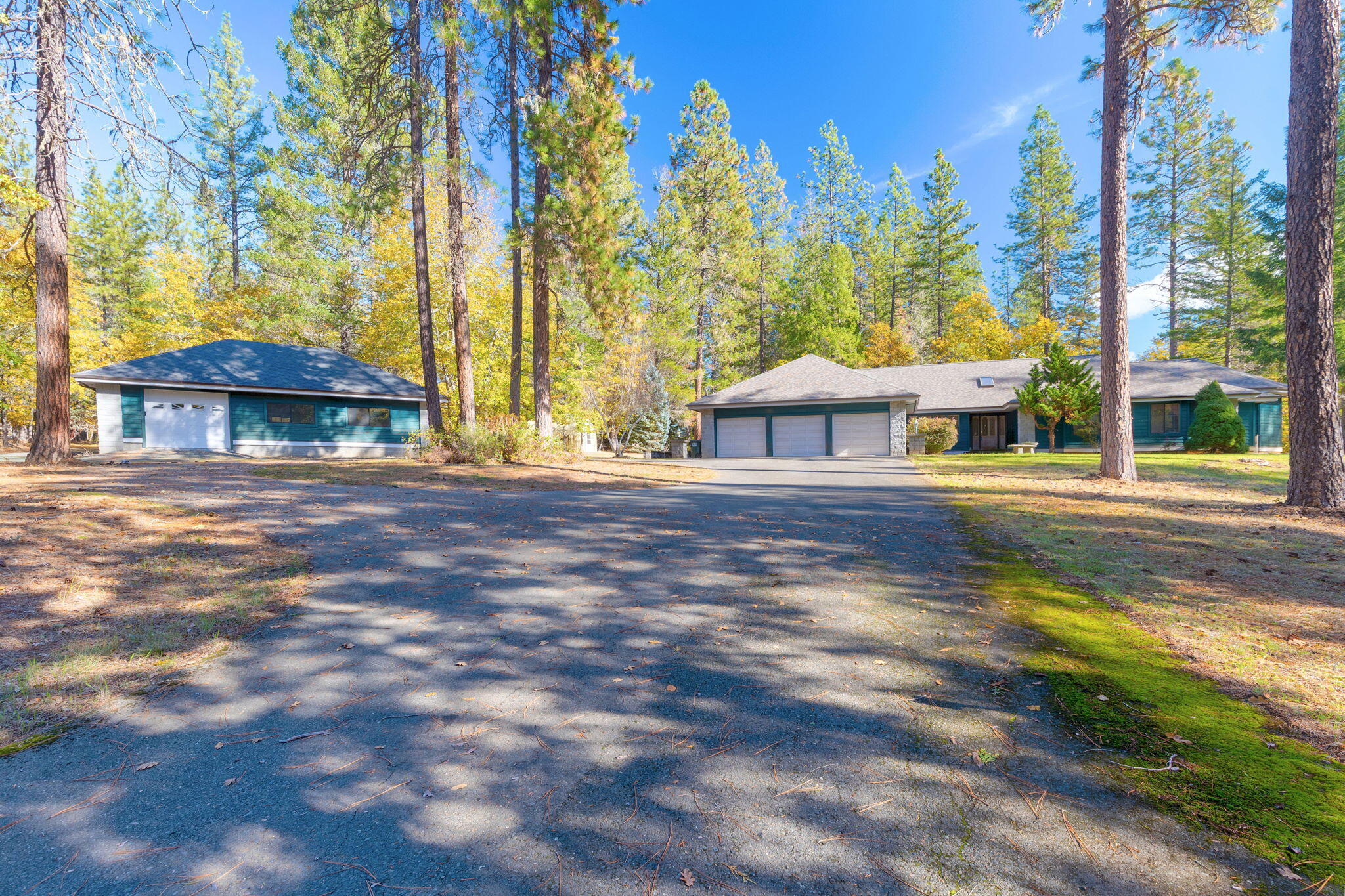 First time on the market! Enjoy quiet country living just 20 minutes from town. This spacious 3,232 square foot home sits on 3 peaceful acres and features 3 bedrooms, 4 bathrooms, a 3-car garage, and a finished detached shop complete with heating and air. The setting feels private yet convenient to both Grants Pass and Medford. The home itself has great bones and generous living spaces- ready for someone with vision to bring it up to date and make it their own. A formal dining and living room, dedicated office with a wall of built-ins, family room and generous primary suite offers room for private spaces and gatherings. A rare chance to own a large home and property in this desirable Rogue River location.