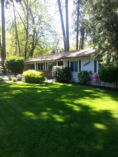Take a Look... At this park-like setting. A little over a half acre and all Oregon has to offer. This home has been well maintained and is move in ready. You're only a couple miles from downtown Grants Pass and all it's conveniences. There is and above-ground pool and deck ready for the hot summer days and a hot-tub off the master bedroom for those warm summer nights. There is a great covered RV area with electric and water. And for the Gardener... A large space for beautiful garden, not to mention the potting-shed and greenhouse. It's all ready to make Oregon your home.