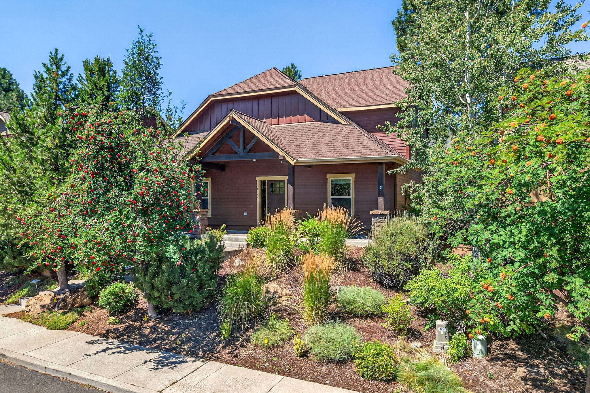 A charming covered front porch and beautiful mature landscaping provide an inviting welcome to this 4 Bedroom home on Bend's Westside. Starting with a spacious great room with soaring vaulted ceilings, gas fireplace and newly refinished hardwood flooring leading into the nearby kitchen with breakfast bar seating; fridge, range & dishwasher, all recently replaced (2022), and adjacent dining area that opens to the fully fenced backyard and paver patio. The full en-suite primary bedroom featuring a large bath with dual sinks, walk-in shower & large closet, along with a sunny guest bedroom/den, laundry room & powder room complete the first floor. The second level, with fresh new carpet, encompasses two additional guest bedrooms, bath and an oversized bonus room with wet-bar and space for all kinds of fun.  Ideally located in the hub of the great Central Oregon outdoor playground, with easy access to the slopes of Mt Bachelor, Cascade Lakes, Mountain Biking & the Deschutes River