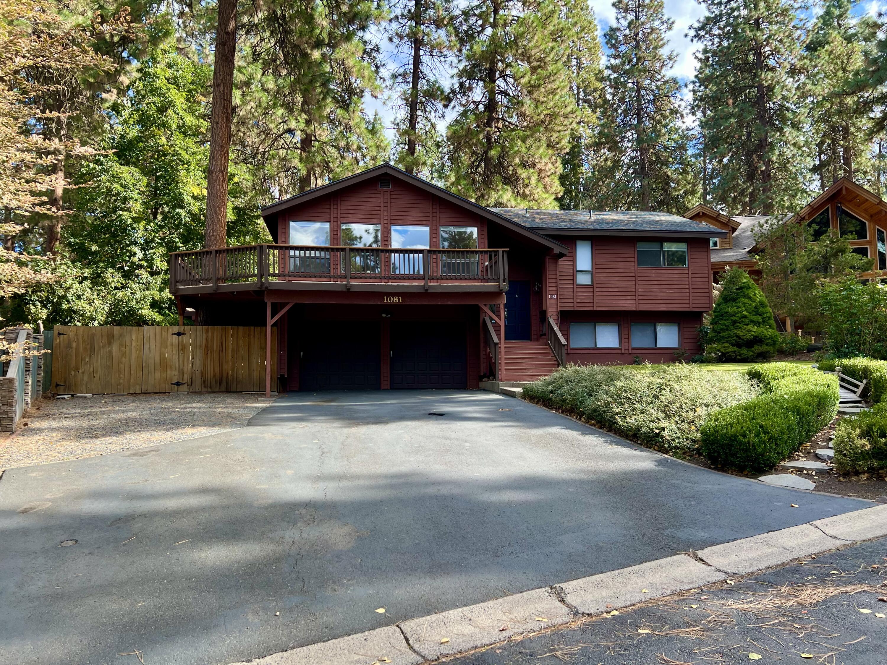 Updated 4-bedroom, 3-bath home in the desirable Lynnewood neighborhood! The open-concept design features vaulted ceilings and abundant natural light, creating a warm, airy ambiance framed by serene ponderosa pines and a peekaboo view of the lake. The remodeled contemporary kitchen showcases quartz countertops, stainless steel appliances, a farmhouse sink, and a sleek modern layout—perfect for entertaining. Beautifully updated bathrooms add comfort and style throughout. Enjoy easy access to Moore Park's scenic hiking and biking trails just down the street. Outside, the large fenced yard offers space to relax, play, or garden. The perfect blend of comfort, style, and location!