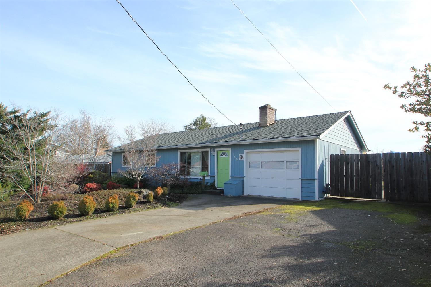 This nicely updated central point home is located right between crater high school and scenic middle school for easy convenience. Beautiful hardwood runs through the entire home. The kitchen is wonderfully updated with natural colors. The living area is highlighted by the cozy fireplace. The laundry room is spacious and well lit. The huge lot offers a nice open fully fenced backyard with access from both the dining area and the master bedroom. There is a Nice deck off the master bedroom for relaxing as well as a great shaded patio for entertaining. The fenced in dog run is a great bonus. RV parking is wide enough for all of your toys and runs from the front of the lot all the way to the back. Just moments to the local market and easy access to downtown as well as I-5.