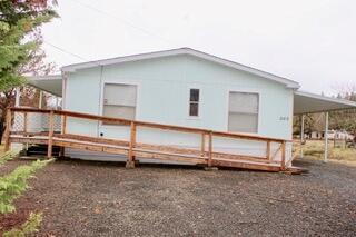 MUST BE MOVED at close of escrow. NO land included in sale. 1990 double wide manufactured home with 1296 sq ft.  3 bedrooms,2 bath in good condition. Sold with heat pump, refrigerator, stove and dishwasher as is. Awnings and porches must be removed.