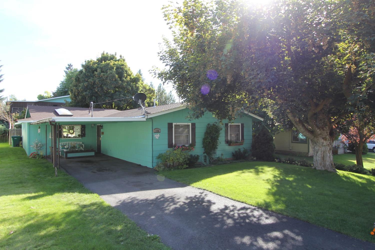 Significantly updated 1748 sq. ft. home shouts pride of ownership. Open floor plan opens up to vaulted sun room with wonderful natural light. Rinnai direct vent gas heater in great room. Coffee bar/laundry area off hallway. Tankless hot water. Split floor plan has 2 bedrooms and bath with fun master suite on other end of home. Amazingly private backyard is fenced, and has large 2 car garage featuring 220 and 2nd carport to the back of lot. Alley access from Lakeview offers RV parking as well. Sun room has 220 if hot tub is desired, skylight and southern exposure for passive solar heat. This is a very nice home.