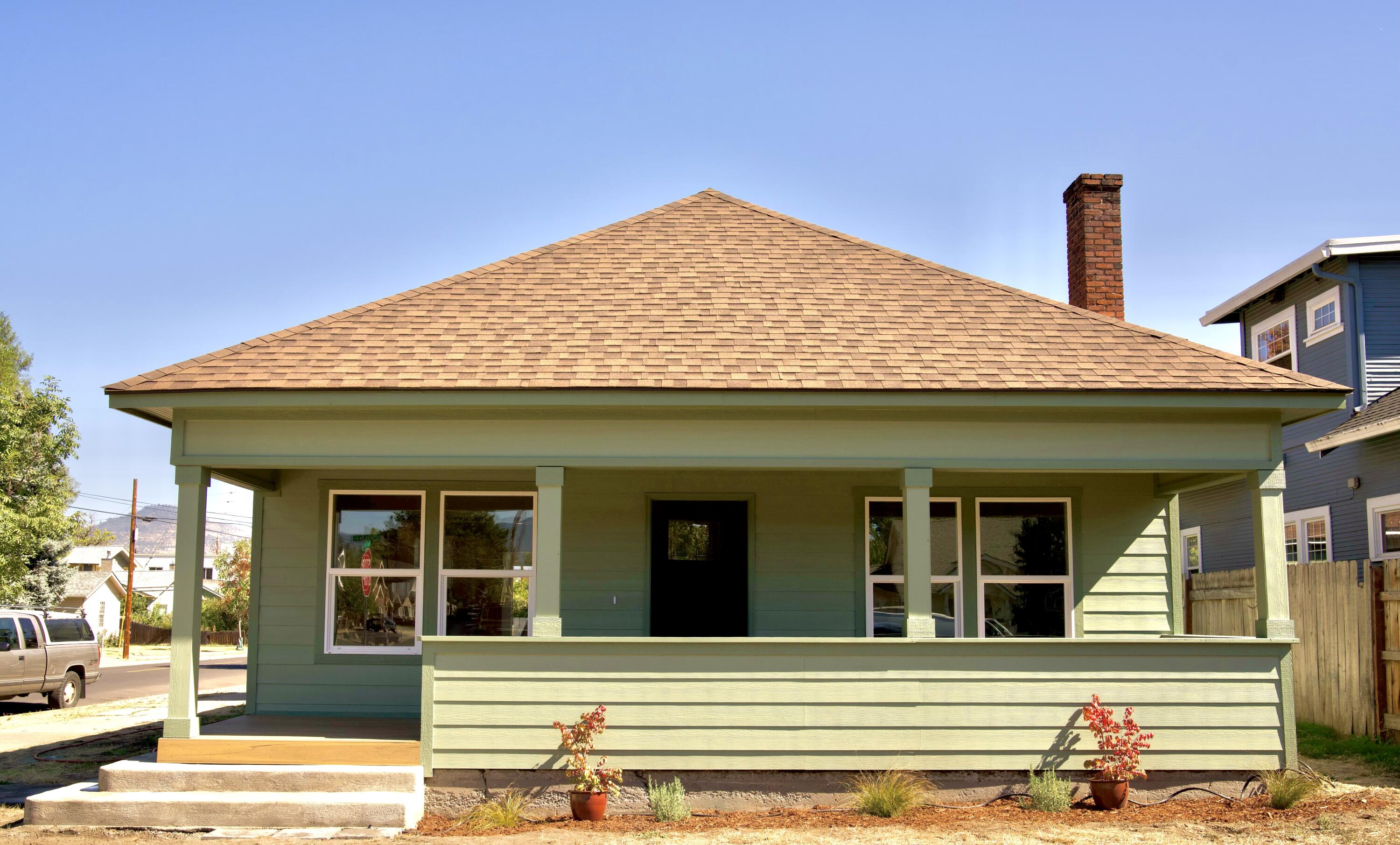 Welcome to an original and charming 1928 built bungalow. Completely remodeled and renovated in 2025. Featuring 1,377 sq ft, 3 bedrooms and 2 full bathrooms. A beautifully lit family room with a fireplace which flows into a dinning / eating area. In the kitchen you will find gorgeous cream wood custom cabinets with granite counter tops, new stainless-steel appliances, laminated white oak wood floors throughout, all new ductless efficient heating and air, tankless water heater, tiled shower in primary bathroom, all new windows and doors / hardware, completely new electrical panel and wiring throughout, new insulation, fresh paint both interior and exterior. Enjoy the large covered front porch with new Trex flooring on these fall days. There is room to build a garage if desired.