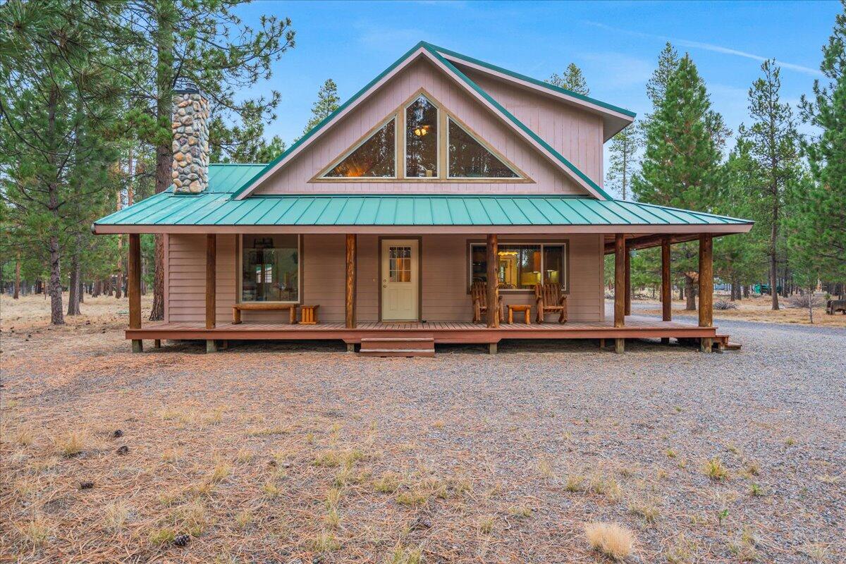 Cozy up on the front porch and wake up to birdsong symphony on 5.09 acres of whispering pines in La Pine, Oregon.  This gem features 2 bedrooms, a loft that flips effortlessly into bedroom #3 and 2 full baths, one with a jacuzzi tub. Snuggle up around a wood stove, or host sunset BBQs on the wrap-around deck! Vaulted knotty pine ceilings add warmth, while 2 story windows frame views of pine trees and blue sky. Whole house Reverse Osmosis system ensures crystal-clear water! Don't miss the guest suite (workshop, office or studio?) perched above a massive 2-car garage—complete with half-bath.  The Wagon Trail Ranch  neighborhood offers amenities: swimming pool, saunas, horse corrals, and access to the Little Deschutes River.  A clubhouse and vast common areas mean community without crowds. Mt. Bachelor is only an hour away! Snag this pine-kissed paradise and start making memories! Rentals allowed.
