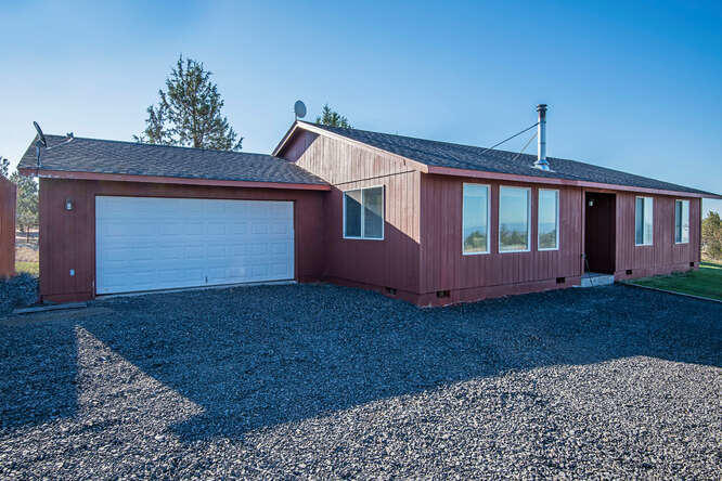 Secluded acreage with comfortable 3Bd  2Ba Home. View of the Cascades! 10 Acres, Riding Arena, 2 large out-buildings (Barn 20X32   2nd Bldg 20X24), Private Well, ATT Septic, zone and wood heat.   Included: Washer, Dryer, Range/oven, and Refrig. 
Country living with a lot of space and free of tight restrictions!