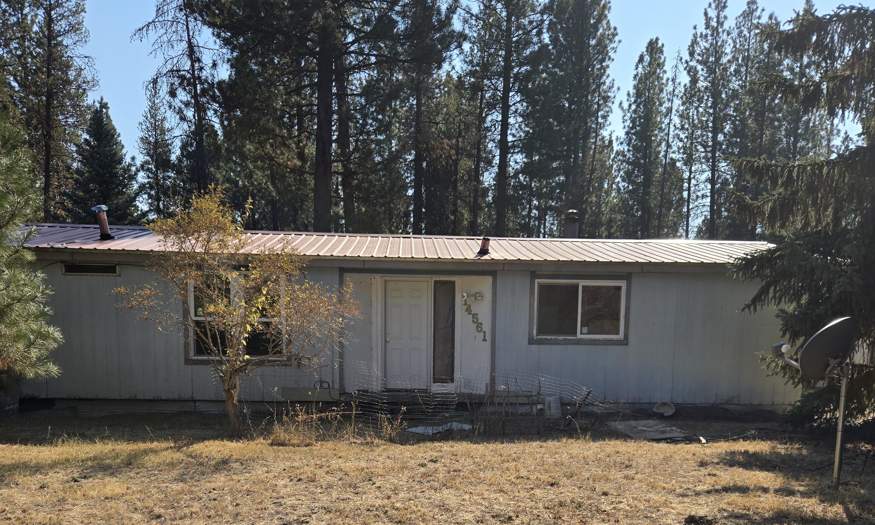 NEEDS NEW WELL AND SEPTIC. This level .80 acre lot features a 1979, 2 bed, 2 bath double -wide manufactured home. 573 sq ft outbuilding has potential for a great project space.
Fixer or an opportunity to build something new.
Serene setting with standard septic and private well.
CASH ONLY