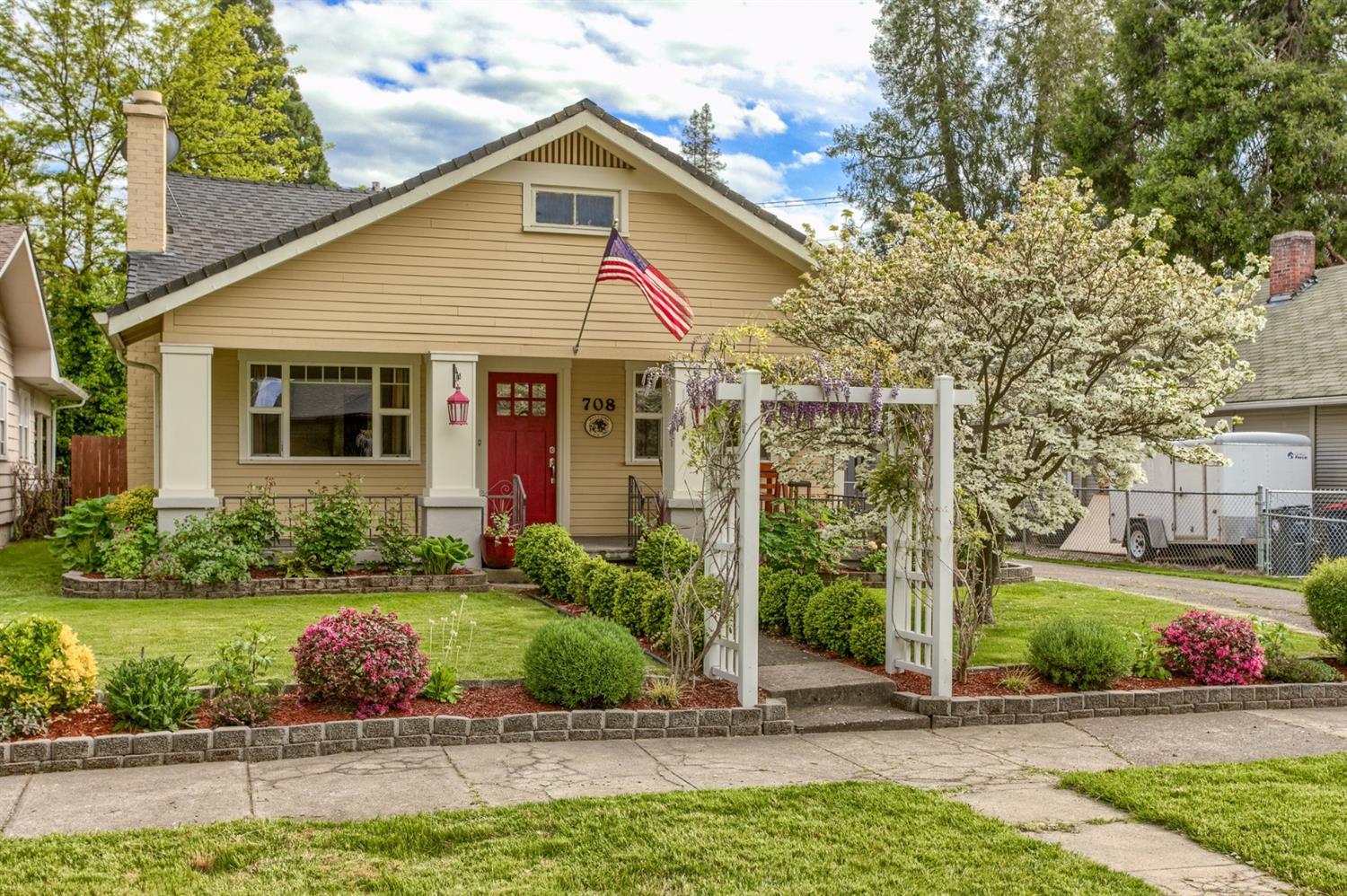 Charming and wonderfully updated craftsman home in E Medford. This home features an open floor plan with 1 bedroom, 1 bathroom, finished large attic that has a variety of uses, wonderful basement with electrical and lighting, beautiful hard wood floors and storage galore. Lovely living room offers a gas fire place and is open to the spacious dining area. Gourmet kitchen features a large island with breakfast bar, duel fuel 5 burner gas range/convection ovens, granite counters, stainless steel appliances, refrigerator and walk-in pantry with cabinets. Huge bedroom with 2 closets, near full bathroom with tile floors and tub/shower. Fantastic separate laundry with double doors, tile floors and great cabinetry. Huge finished attic, attached to loft with more storage space. Enjoy the natural light in the home and large covered front porch. Double RV gate in backyard as well. Detached shop/outbuilding and long driveway to fit multiple vehicles.