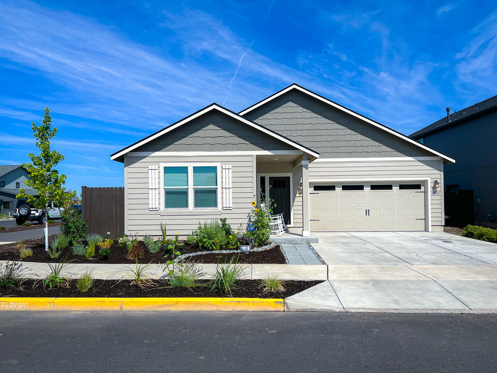 Welcome home! This move-in-ready gem in the highly sought-after Maple Meadows subdivision is the answer to your housing dreams. Step inside to be greeted by 9' vaulted ceilings and an open floor plan that seamlessly blends style and functionality. The spacious primary bedroom is a true retreat, complete with a luxurious tub and a generous walk-in closet, providing the perfect space to unwind and relax after a long day. What truly sets this home apart are the thoughtful upgrades throughout. Immerse yourself in the luxury of immense LVP flooring, perfect for both aesthetics and durability. Imagine preparing and then sipping your morning coffee at your own personal coffee bar, adding an extra layer of convenience and charm to your daily routine. The wood blinds and additional windows flood the space with natural light, creating a warm and inviting atmosphere. The full tile backsplash in the kitchen adds a smart touch of elegance. Don't miss your chance to make this incredible house yours