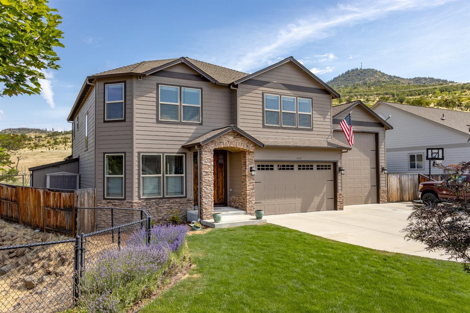 Custom built, one owner home with great quality throughout. Open floorplan with chef's kitchen including double wall ovens, five burner gas cooktop, walk-in pantry, plenty of counter space on the stunning granite counters and an abundance of cabinet storage. The adjacent living room and dining area make it the perfect spot for all your entertaining needs. The extra-large slider off the dining leads to the covered outdoor patio to take in the surrounding territorial views. There is a main level office (with a closet) and half bath. Upstairs you will find a secondary living space and four oversized bedrooms. A Jack and Jill bathroom connects two of the bedrooms. The master suite has dual sinks, oversized jetted tub, heated floors and walk in closet. Don't miss the rare find - a 1000+ SF garage with an enclosed RV parking bay, room for two addtnl cars plus additional RV parking along the side. Corner lot with awesome privacy & great natural light throughout.
