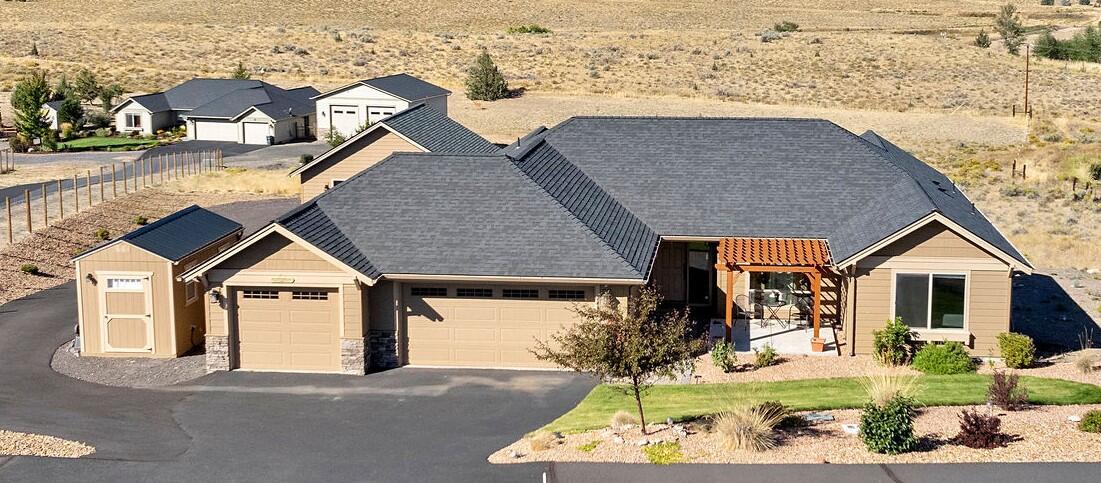 Custom Ranch Style Home on two acres with breathtaking mountain views. Built in 2020 this quality home has been upgraded and well cared for inside and out. Upgrades include insulated interior plumbing walls, ceiling fans,  upgraded insulation in attic, glass doors in showers and upgraded lighting outside.  Large Primary Bedroom has deck access. Tile upgrades in all bathrooms, jetted tub in Master Bath. Use the third bedroom\den as a bedroom, an office or both as it has a custom built Murphy Bed.  Beautiful pergola adorns the front yard for your enjoyment. Shop is 26'x26' heated\cooled, professionally coated floor, gutters and a 30amp circuit.  Surprise, under the house has over 700 square foot of storage area with a concrete floor. Outside landscaping recently completed with drip system, sprinkler system, asphalt and large accent rocks. RV Parking. Schedule your showing to see all that this home has to offer.